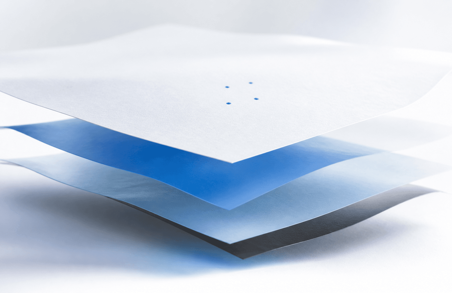 Une couche blanche stable flotte au-dessus de couches bleues, grises et noires interchangeables.